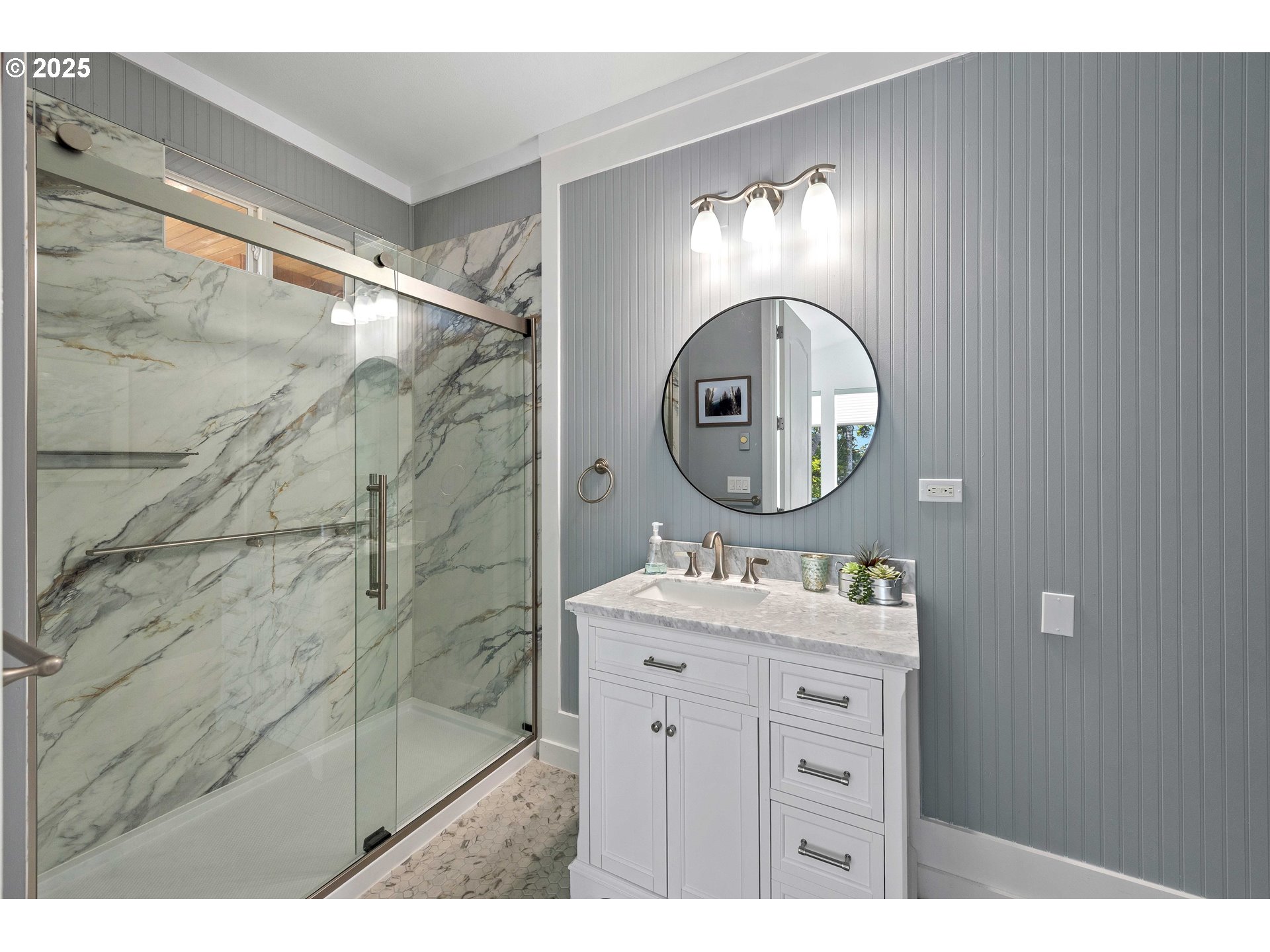 53 Shoreline Drive Florence, OR 97439 - Photo 15 of 36 a bathroom with a sink mirror and a shower