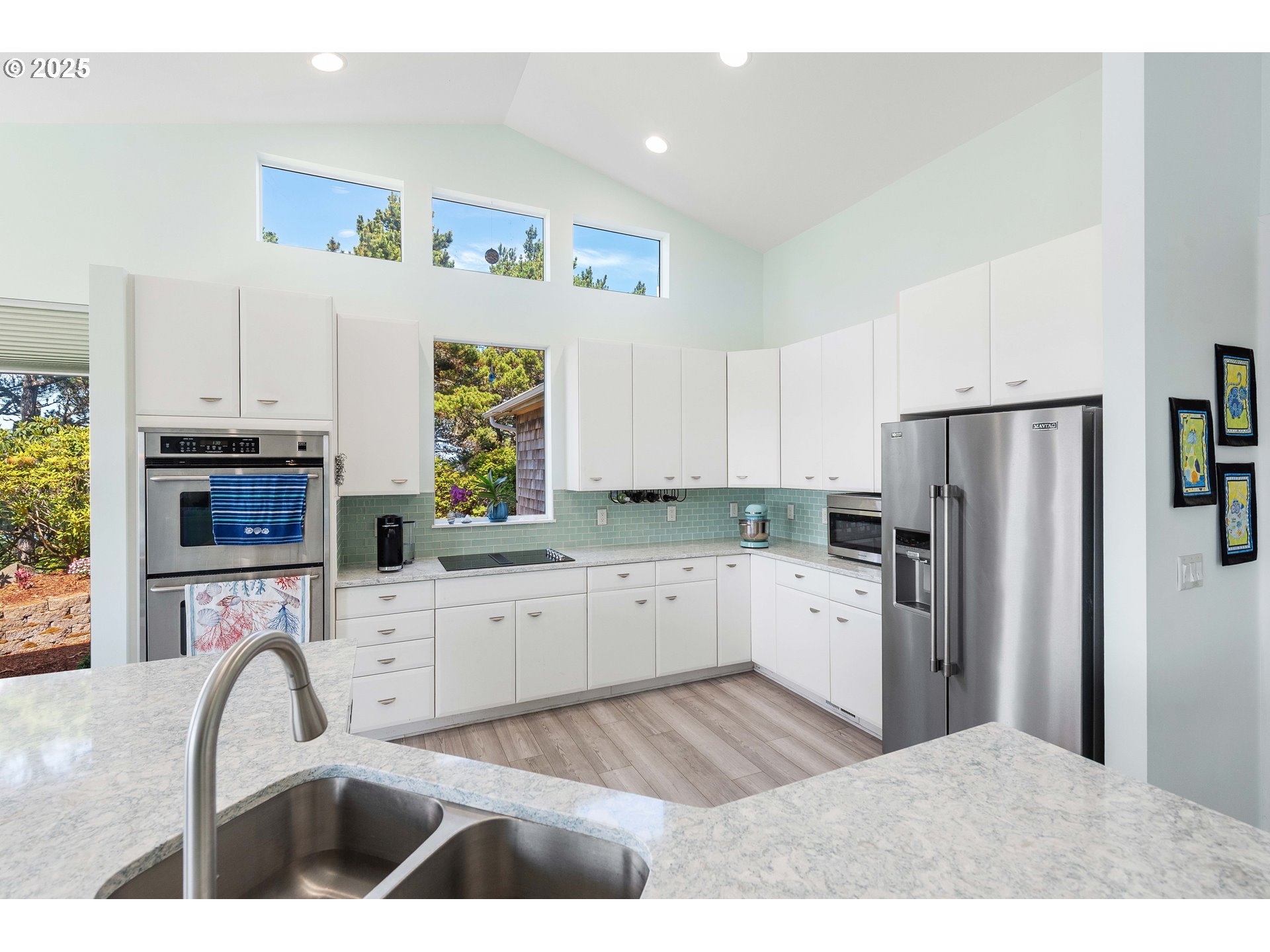 53 Shoreline Drive Florence, OR 97439 - Photo 23 of 36 a kitchen with a refrigerator cabinets and wooden floor