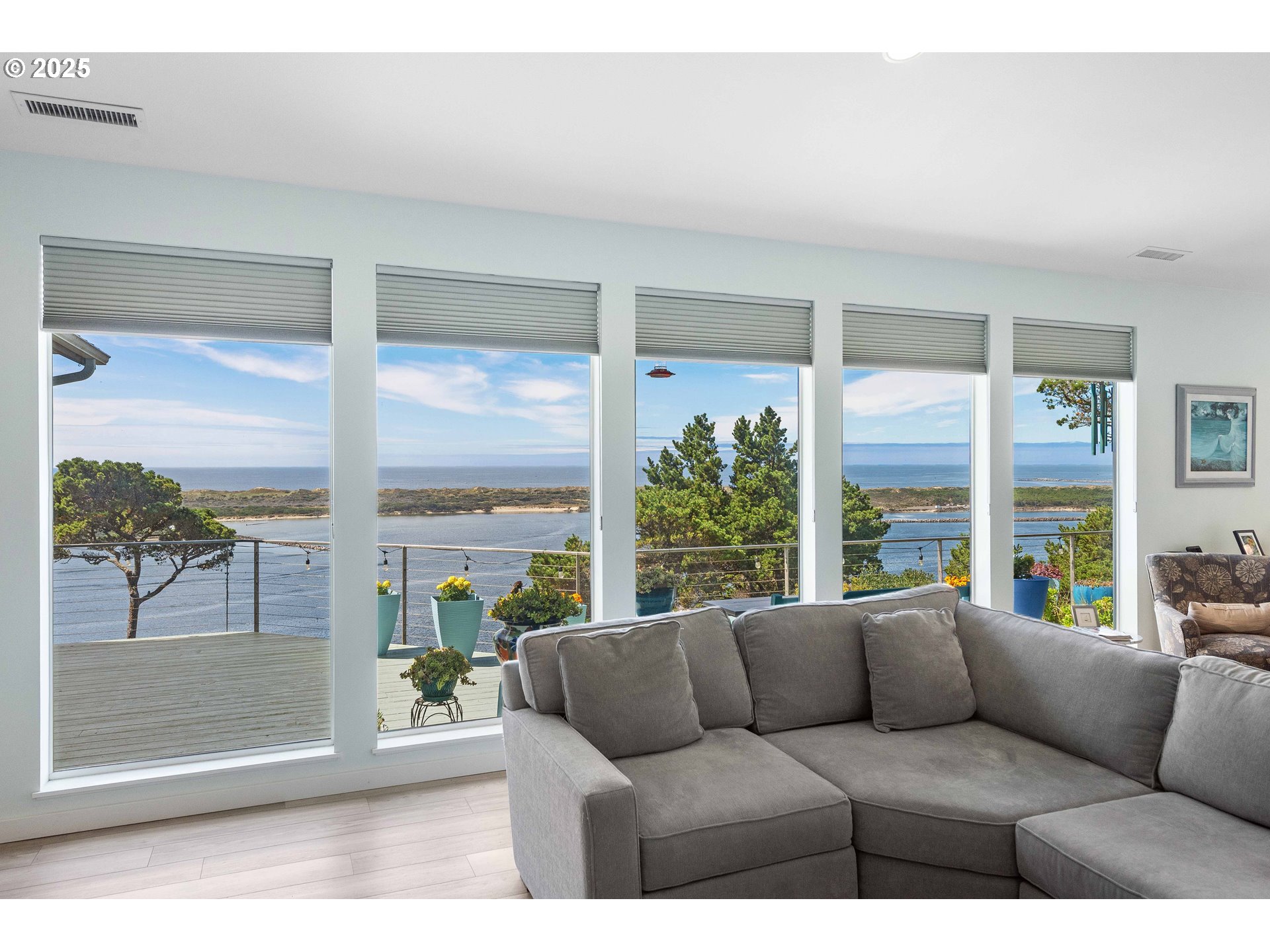 53 Shoreline Drive Florence, OR 97439 - Photo 25 of 36 a living room with furniture and a floor to ceiling window