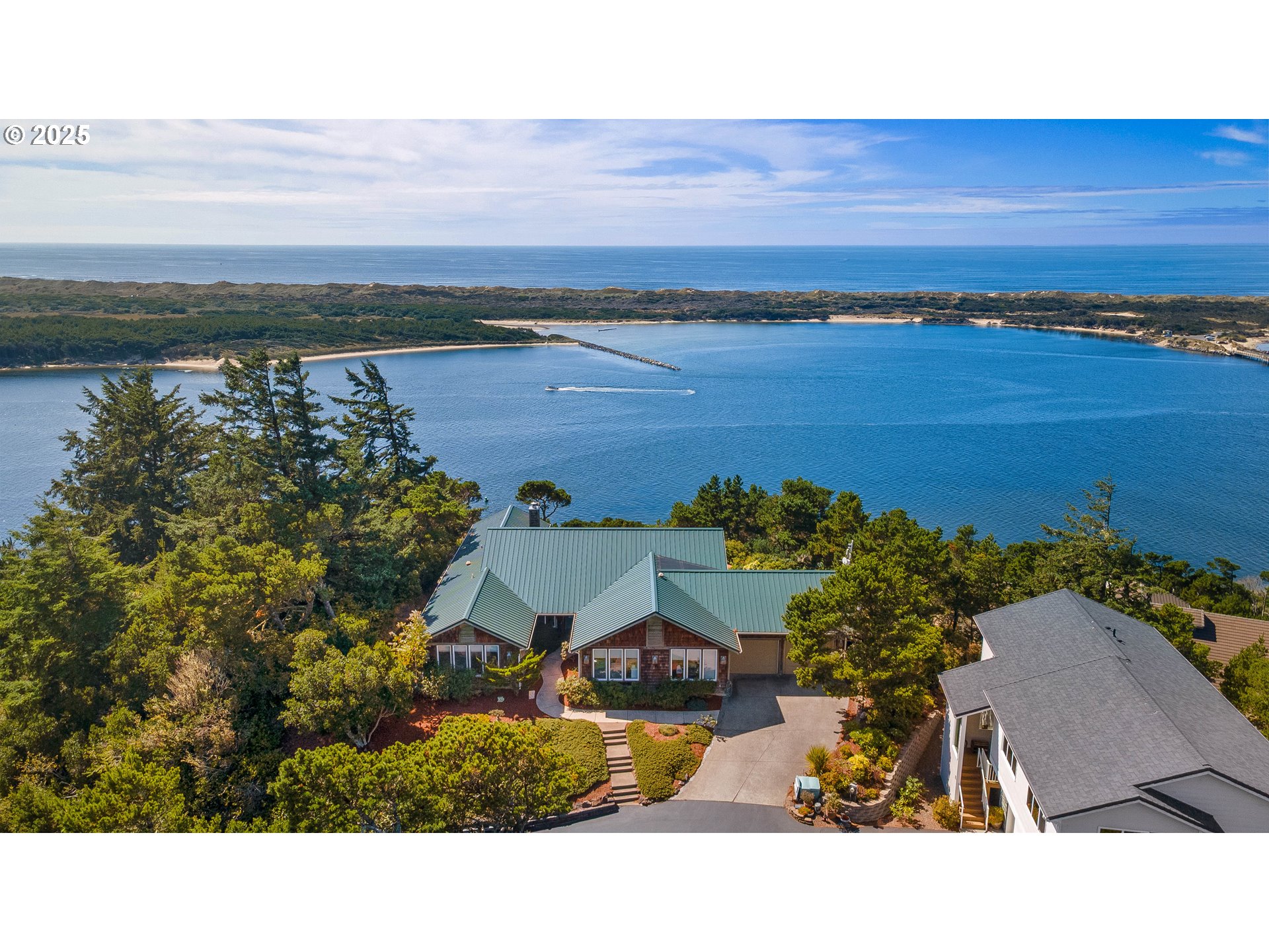 53 Shoreline Drive Florence, OR 97439 - Photo 5 of 36 a view of a lake with a outdoor space