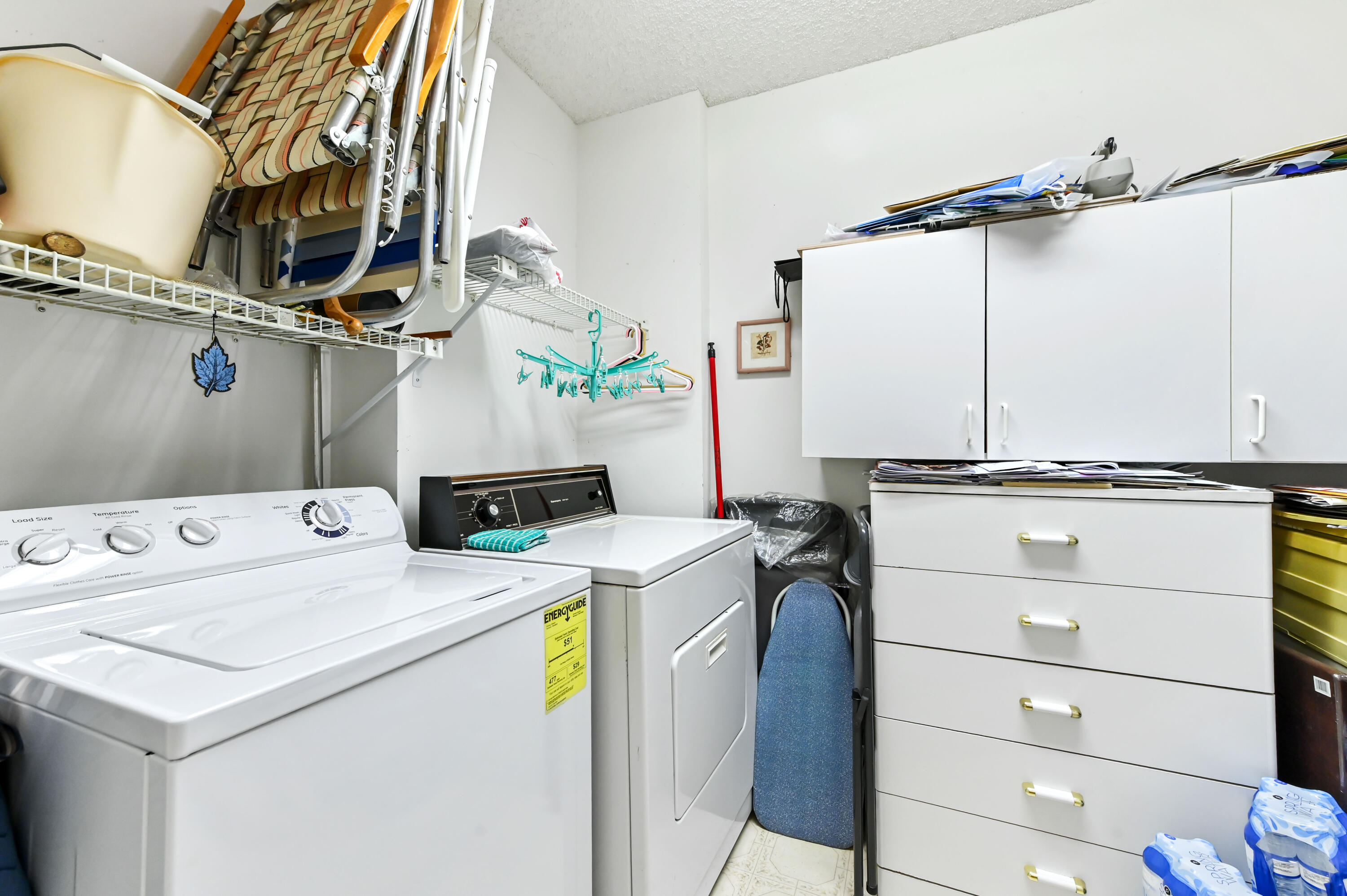 15074 Witney Road, Unit 107 Delray Beach, FL 33484 - Photo 18 of 60 a utility room with dryer and washer