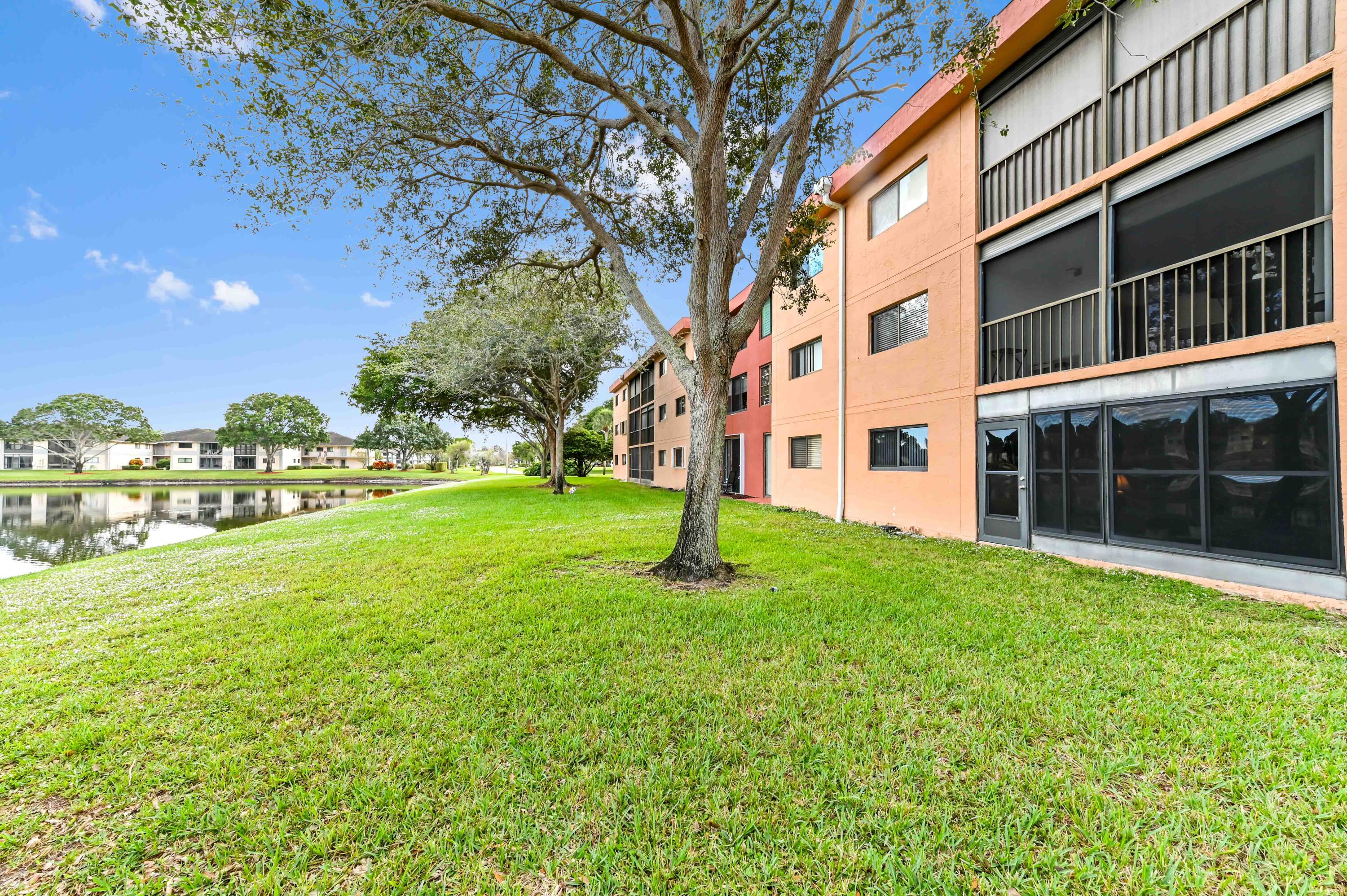 15074 Witney Road, Unit 107 Delray Beach, FL 33484 - Photo 27 of 60 a house with garden in front of it