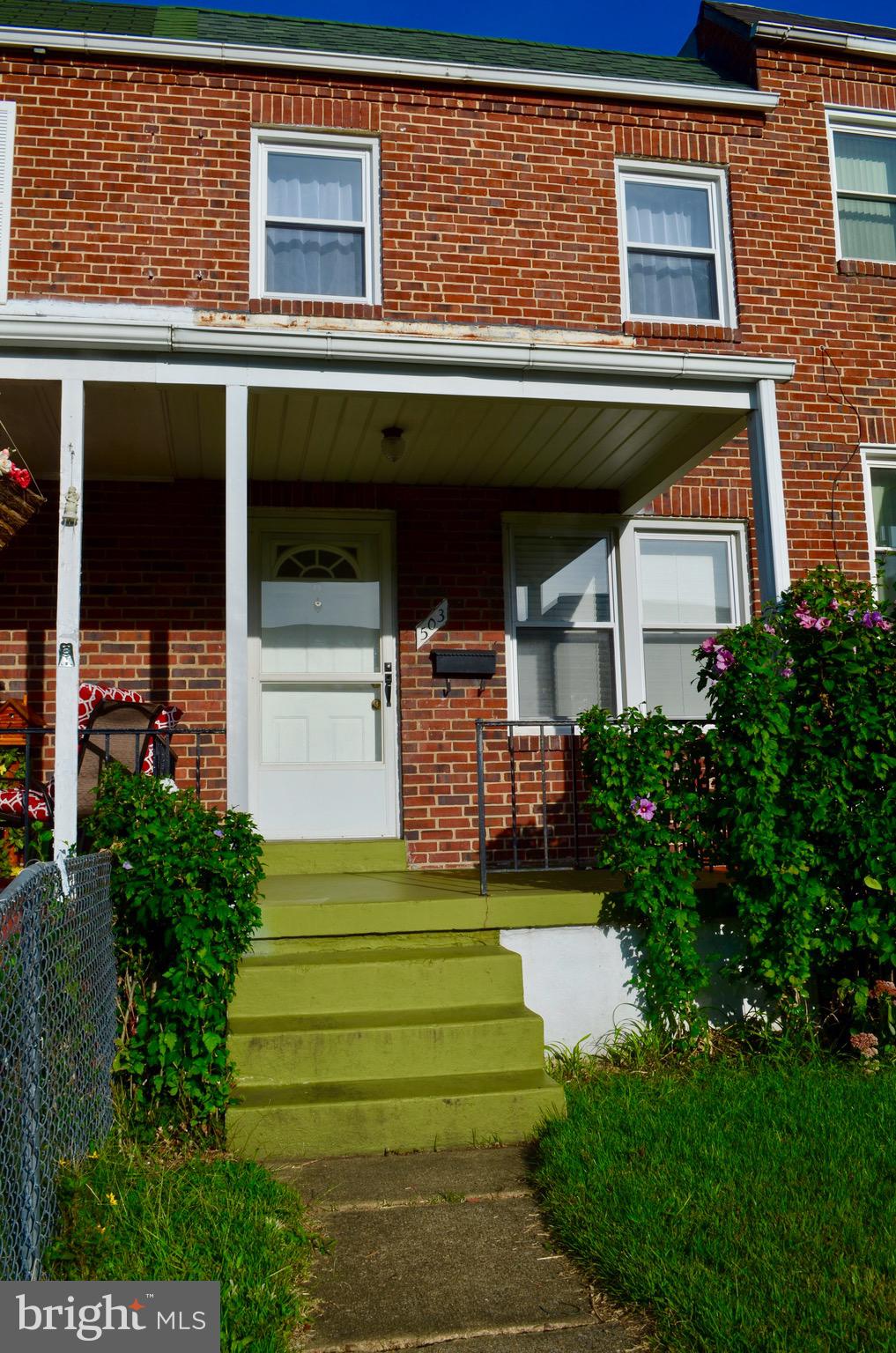 All brick row home with a deck!