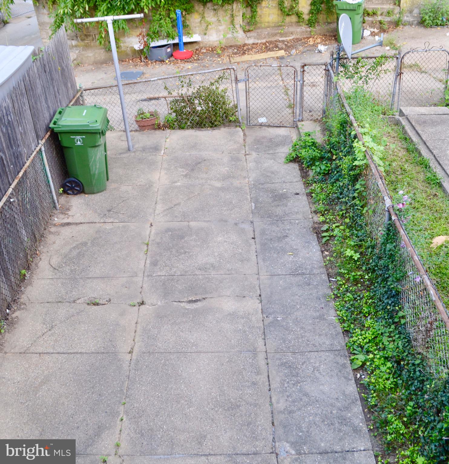 503 Sunset Road Baltimore, MD 21223 - Photo 21 of 21 Fenced in backyard, there's a deck too!