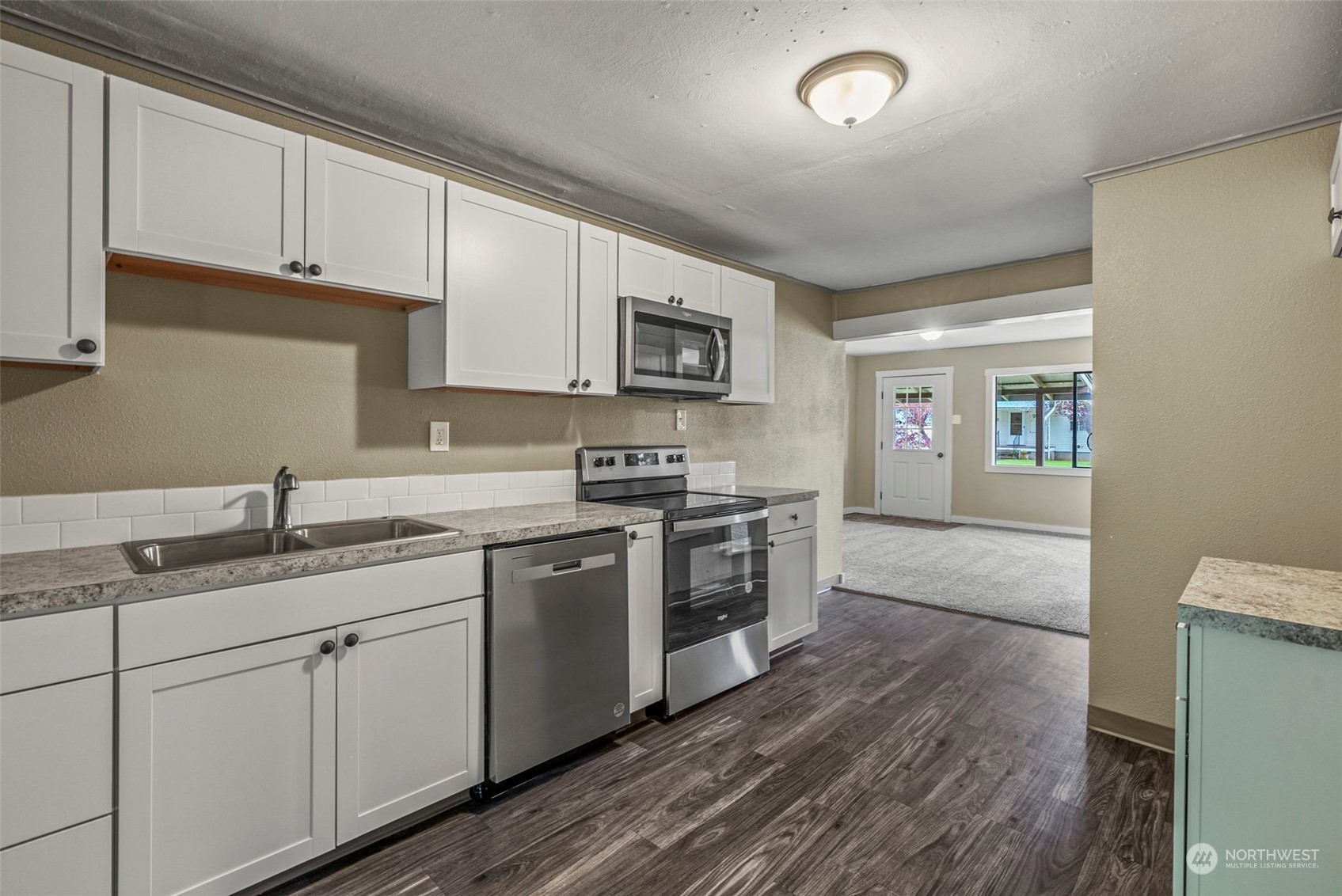 259 Stowell Road Salkum, WA 98582 - Photo 8 of 19 a kitchen with stainless steel appliances granite countertop a sink stove and cabinets