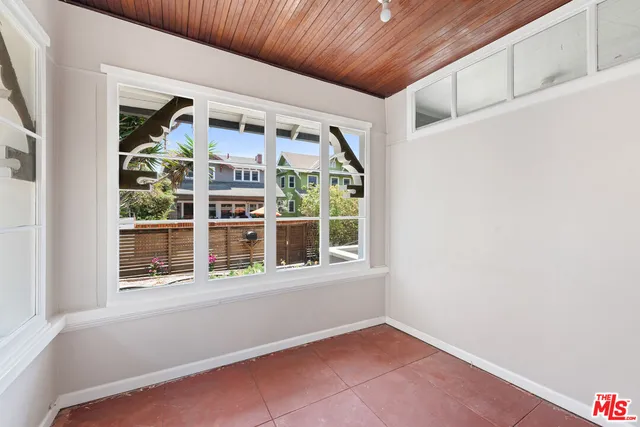 a kitchen with a stove a sink and a refrigerator