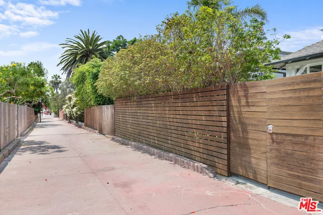 a view of a livingroom with a fireplace a fireplace and windows