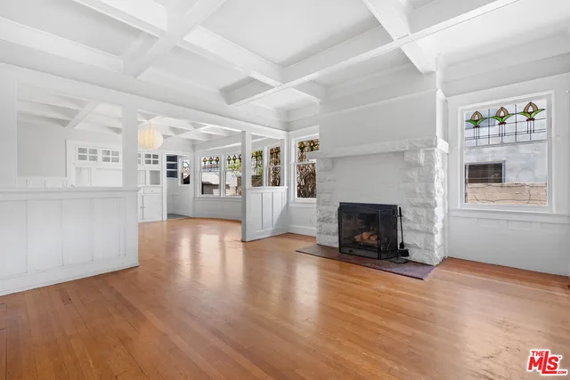 a living room with fireplace furniture and a flat screen tv