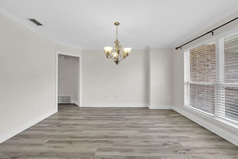 a view of a livingroom with wooden floor
