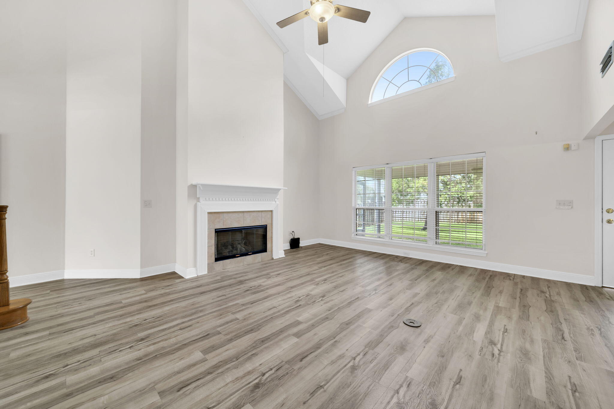 202 Gracie Lane Niceville, FL 32578 - Photo 14 of 47 a view of empty room with wooden floor and fan