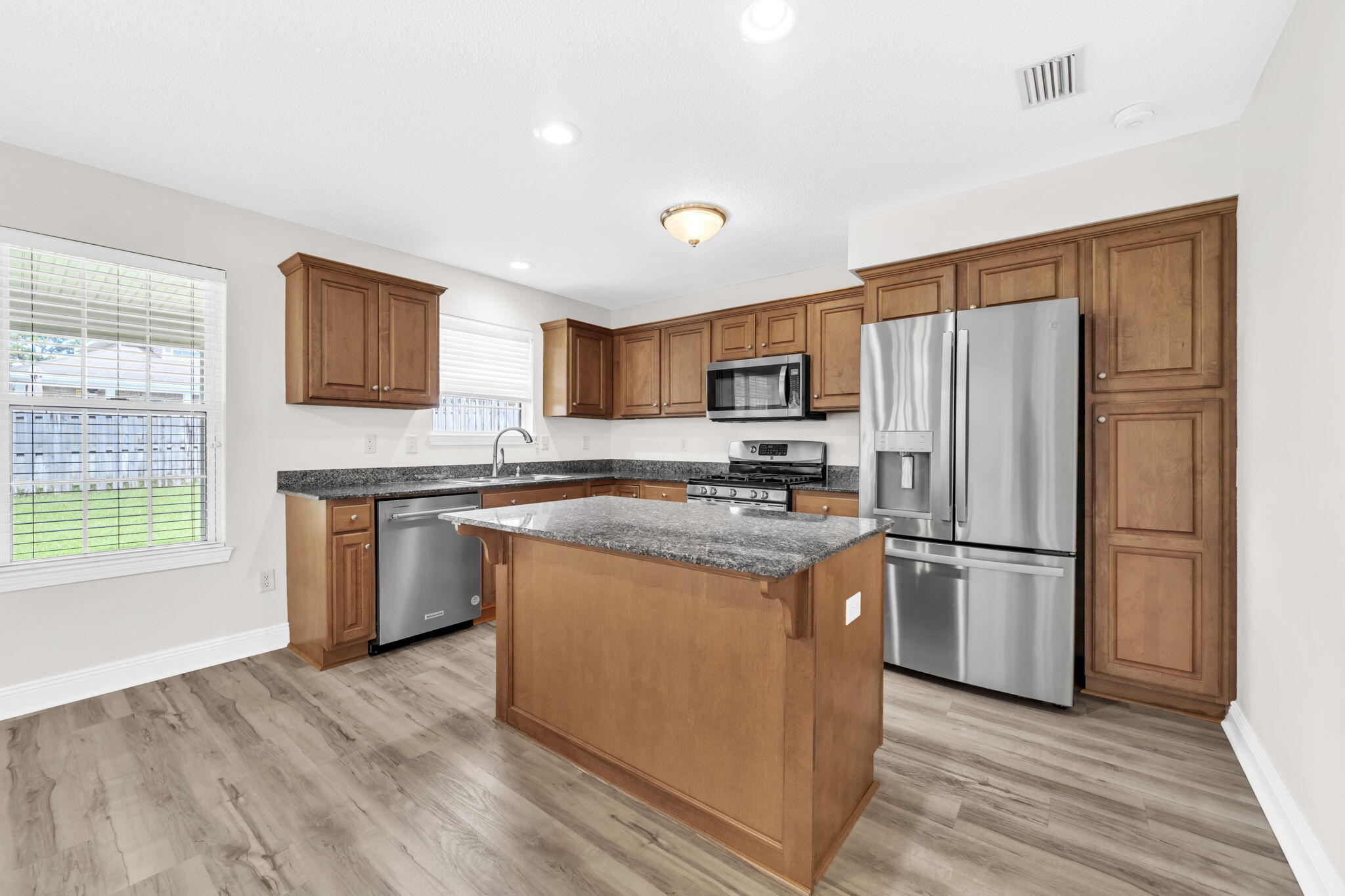 202 Gracie Lane Niceville, FL 32578 - Photo 20 of 47 a kitchen with stainless steel appliances granite countertop a refrigerator stove and sink