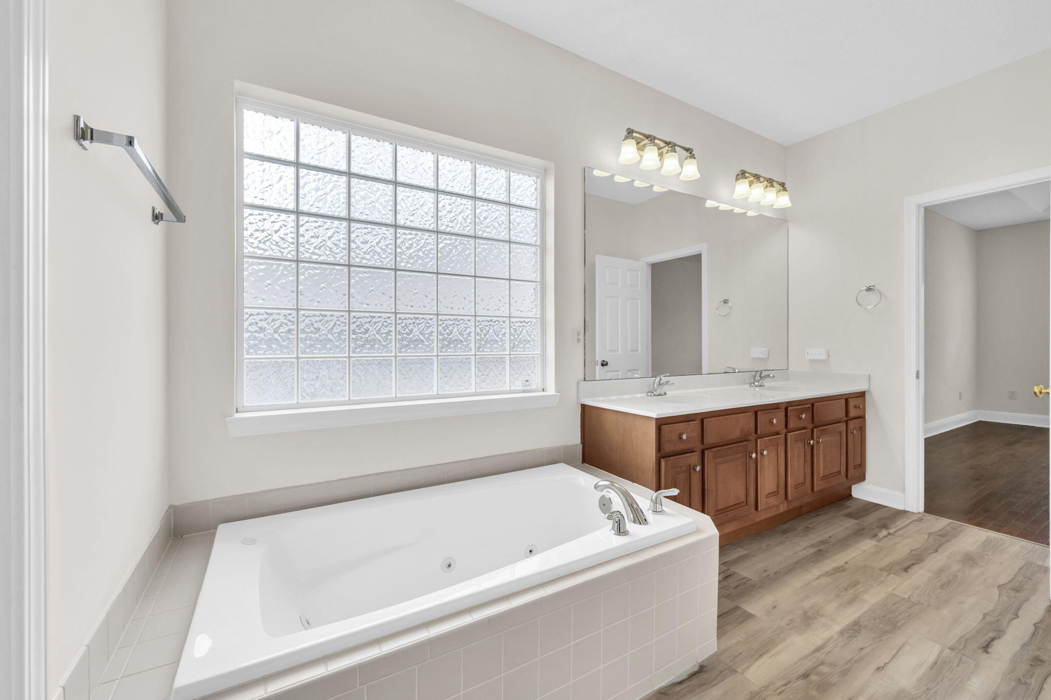 202 Gracie Lane Niceville, FL 32578 - Photo 30 of 47 a bathroom with a tub sink and mirror