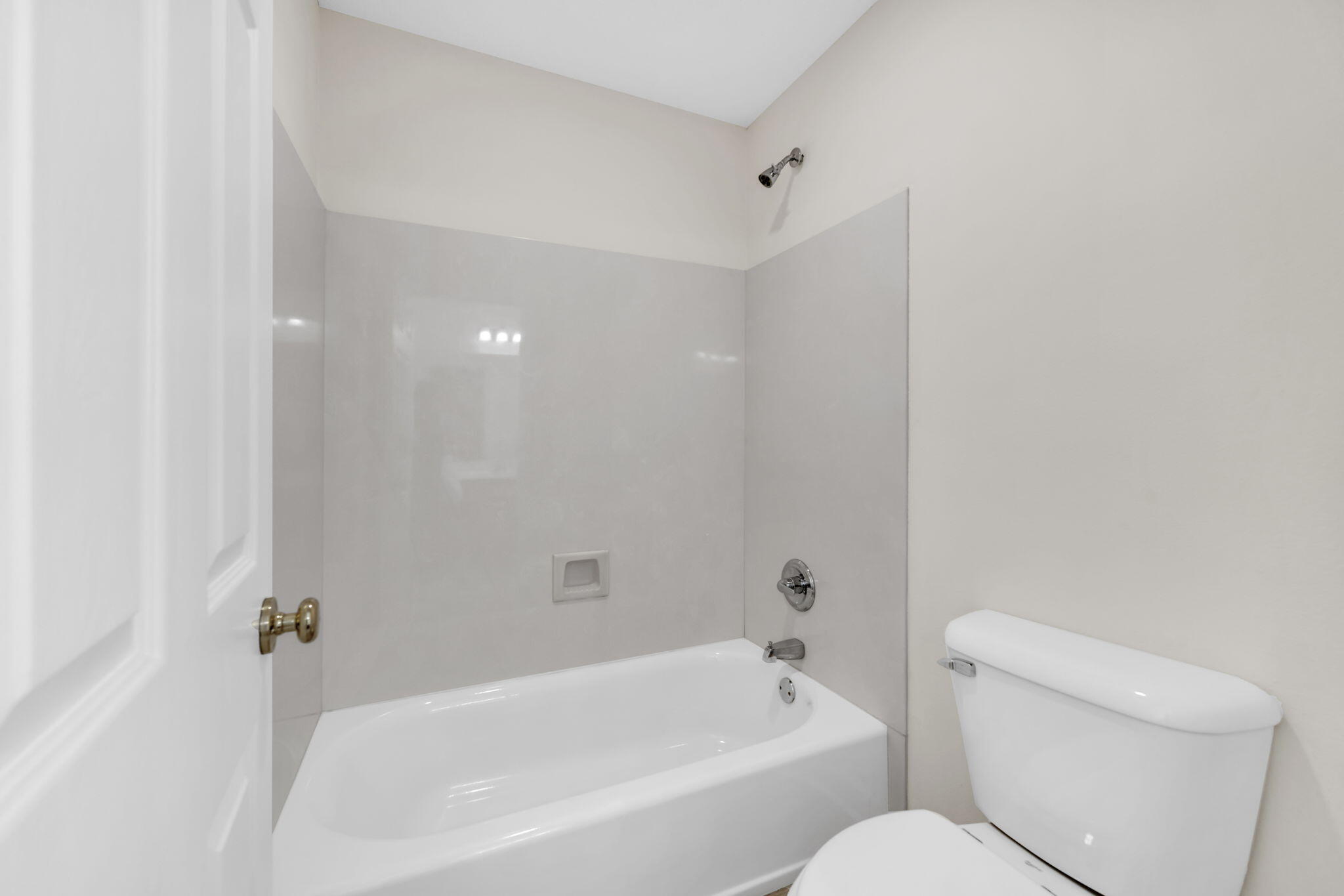 202 Gracie Lane Niceville, FL 32578 - Photo 37 of 47 a bathroom with a toilet and bathtub