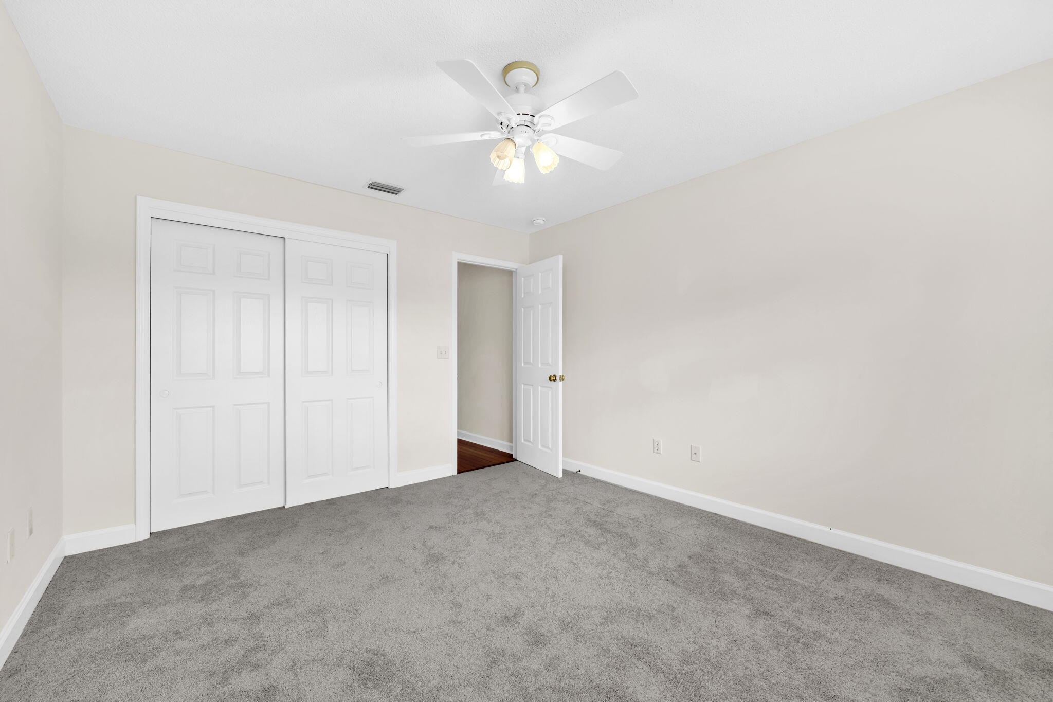 202 Gracie Lane Niceville, FL 32578 - Photo 42 of 47 a view of an empty room with a ceiling fan