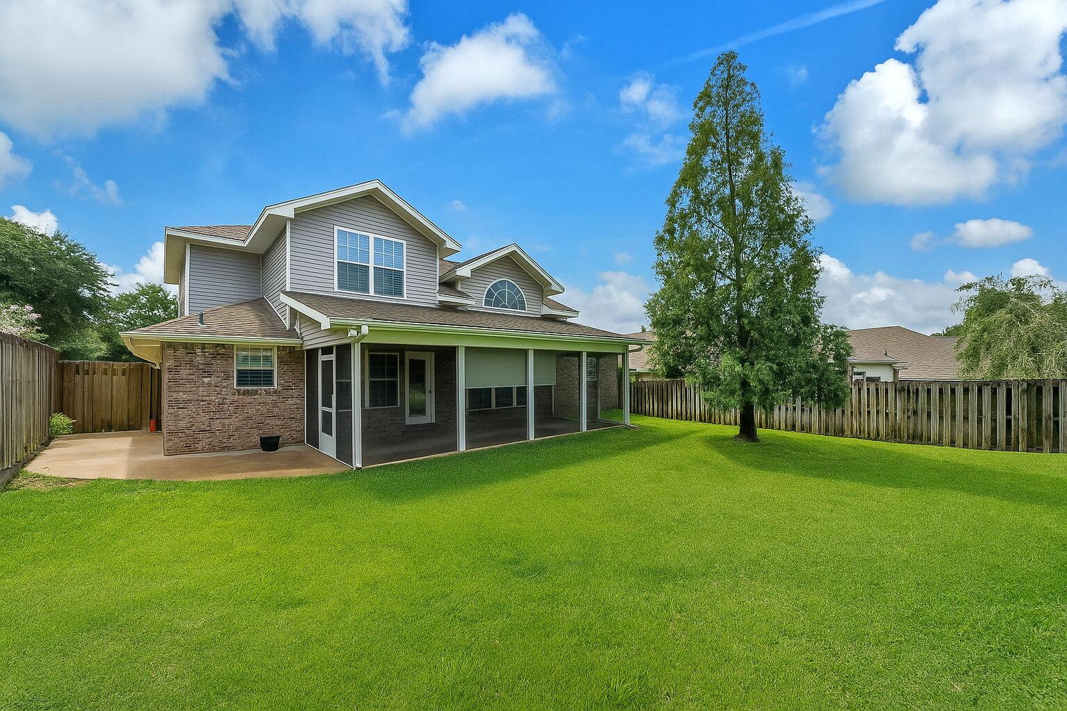 202 Gracie Lane Niceville, FL 32578 - Photo 6 of 47 a front view of a house with a yard and trees