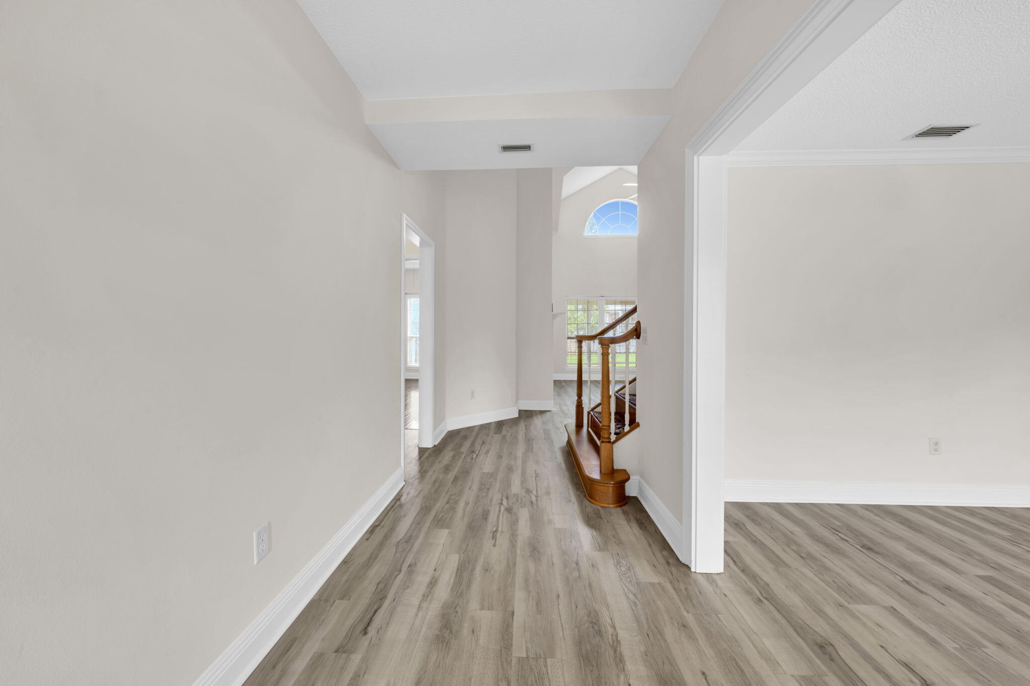 202 Gracie Lane Niceville, FL 32578 - Photo 9 of 47 a view of hallway with wooden floor