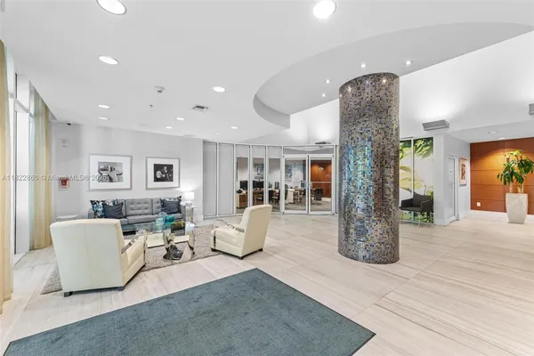 a living room with fireplace furniture and a wooden floor