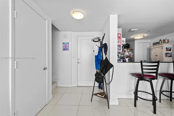 a room with gym equipment and a view of living room