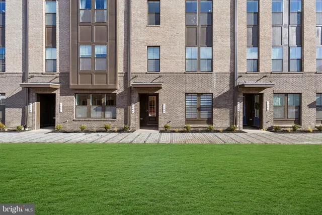 a large building with a yard in front of it