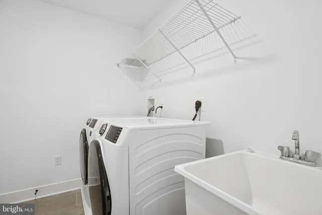 a bathroom with a double vanity sink mirror and shower