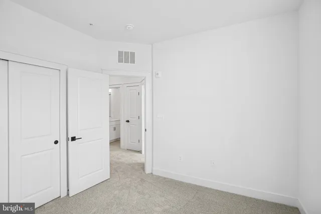 a front view of a building with a street