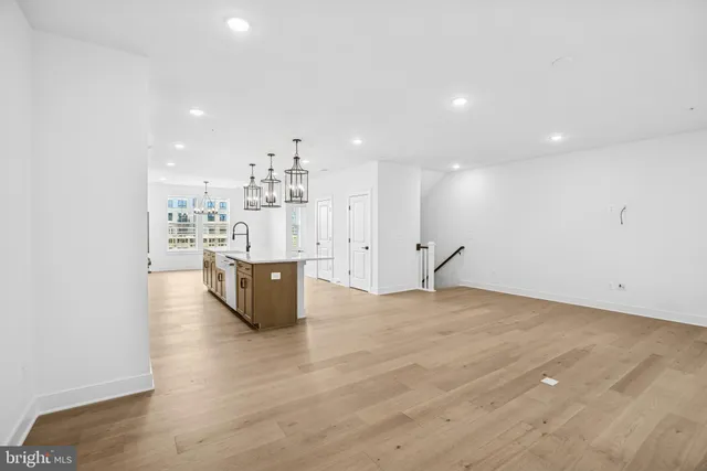 a bathroom with a sink mirror and toilet