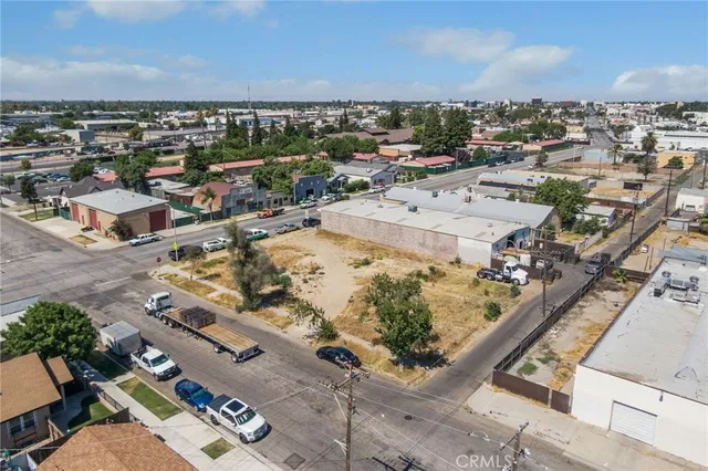 an aerial view of a residential building with outdoor space