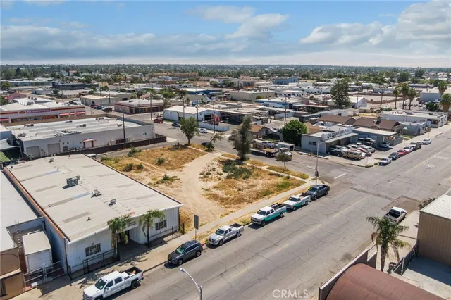 a view of swimming pool with outdoor seating and green space