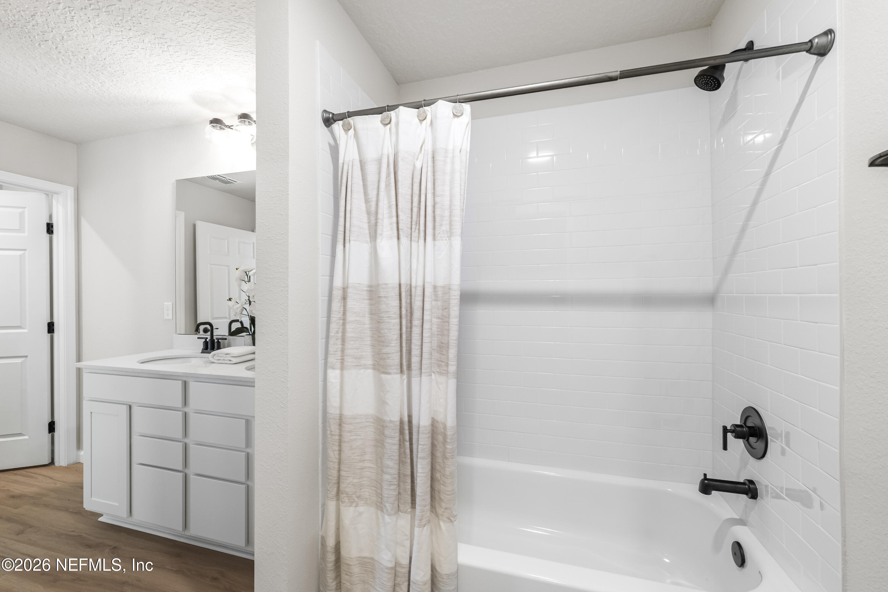 4355 Longmire Road Middleburg, FL 32068 - Photo 12 of 19 a bathroom with a bathtub and a shower