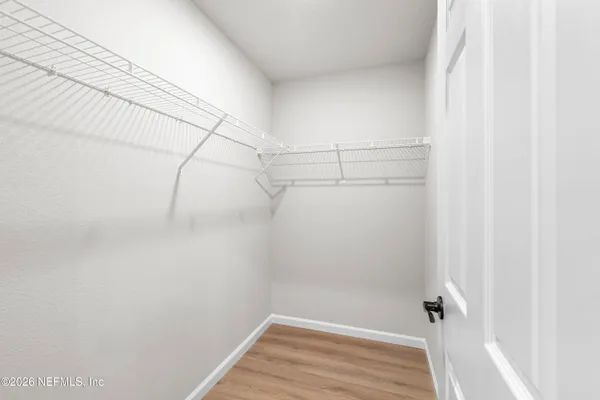 a view of a room with racks on the wall