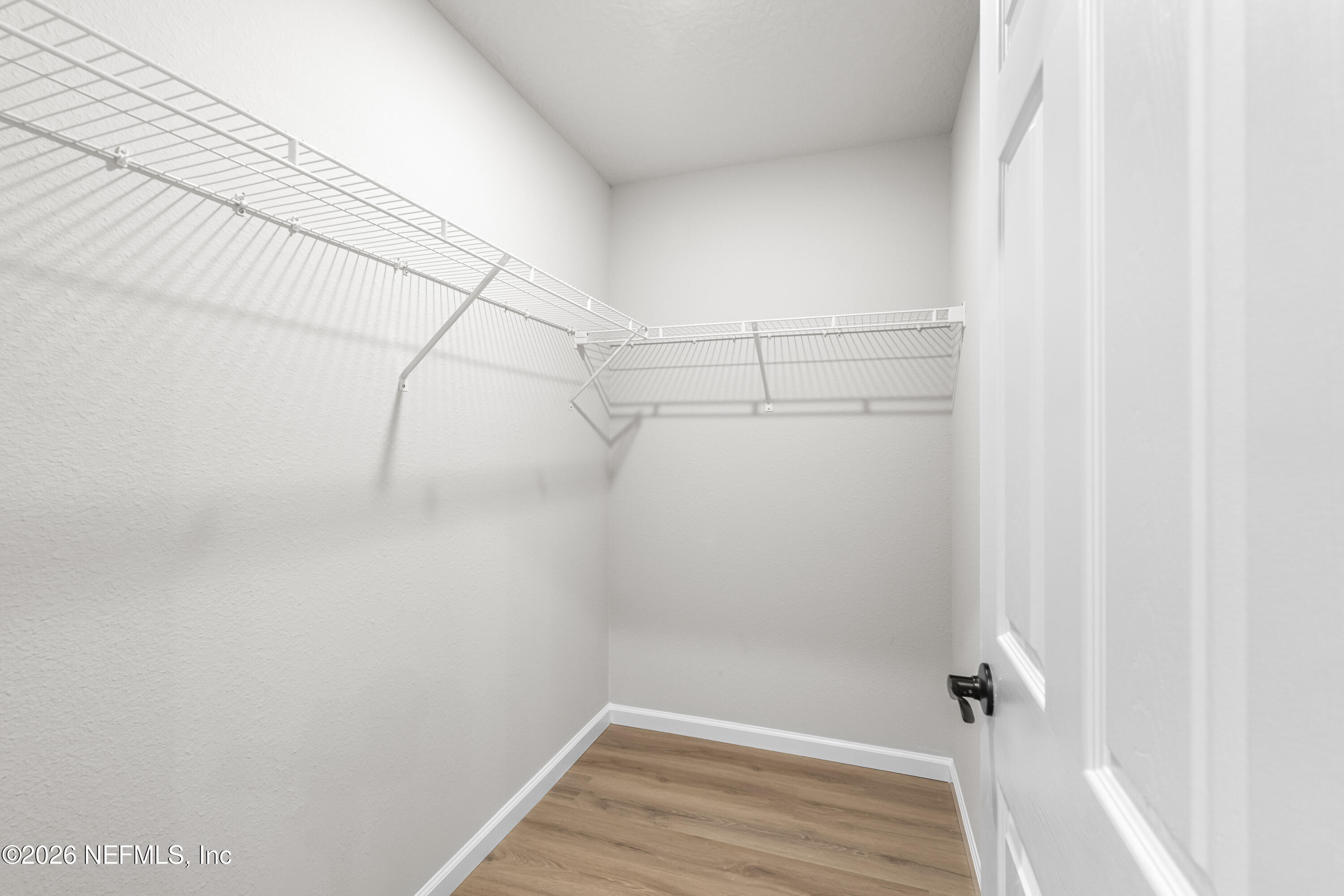 4355 Longmire Road Middleburg, FL 32068 - Photo 13 of 19 a view of a room with racks on the wall