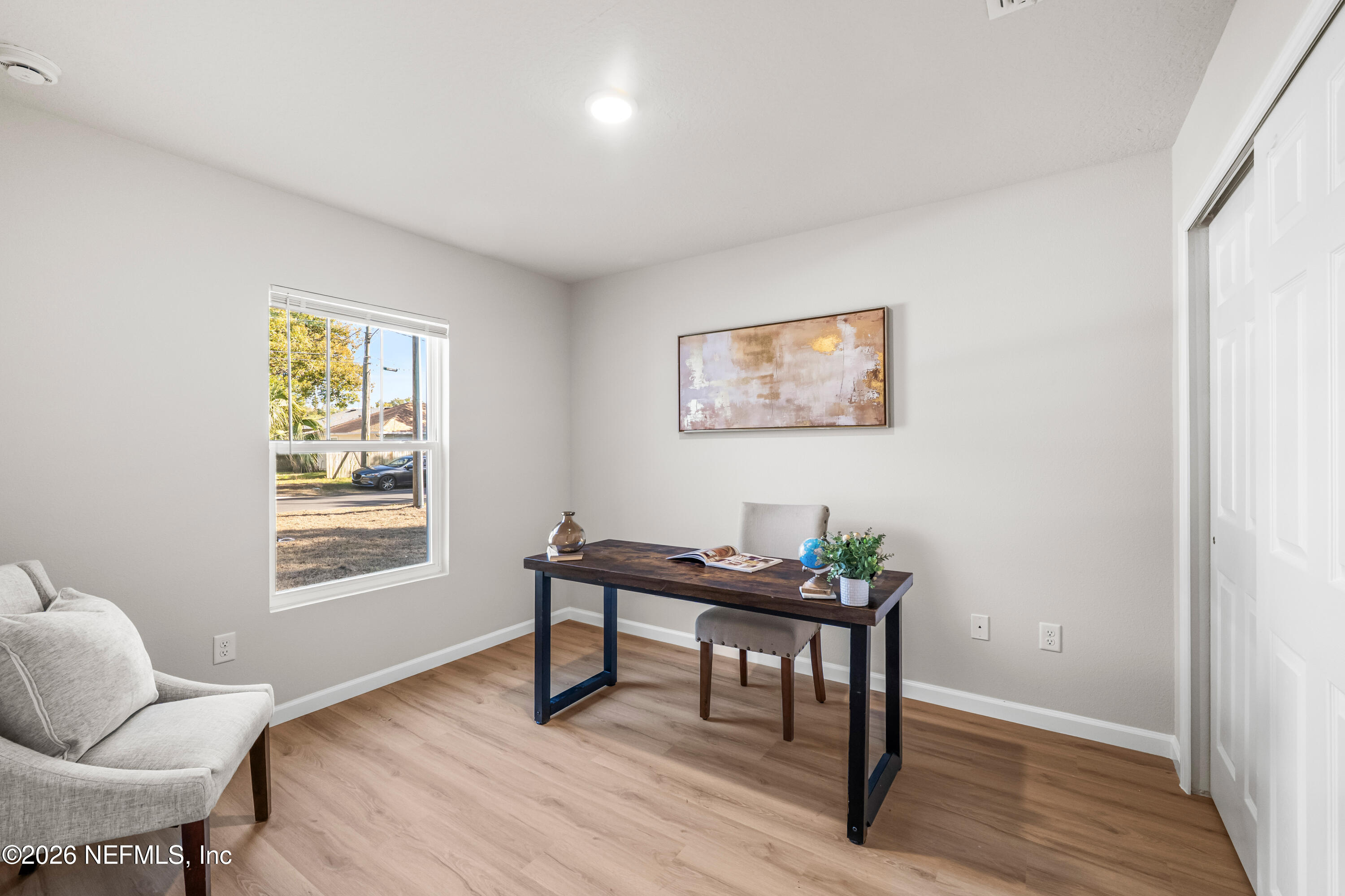 4355 Longmire Road Middleburg, FL 32068 - Photo 14 of 19 a view of a workspace with furniture and a window
