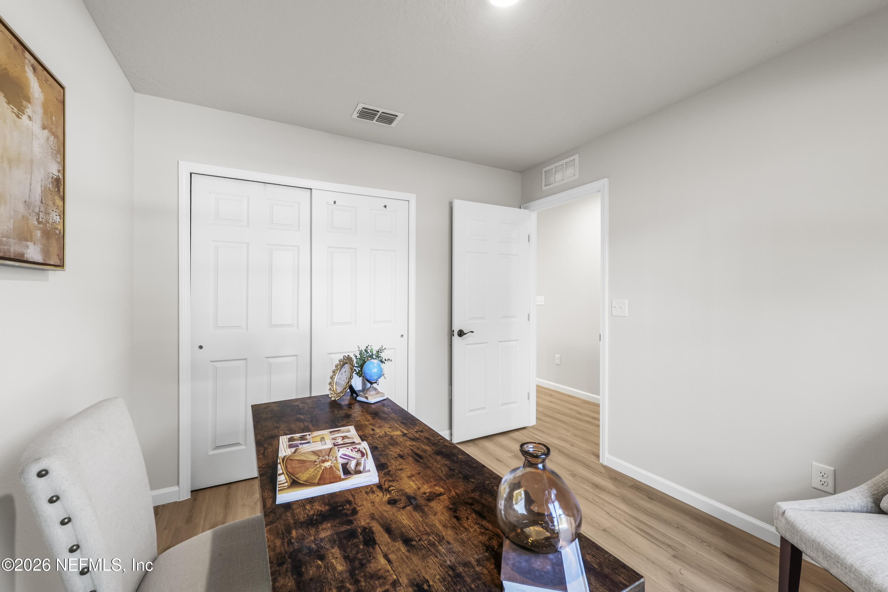 4355 Longmire Road Middleburg, FL 32068 - Photo 15 of 19 a view of a workspace with furniture and wooden floor