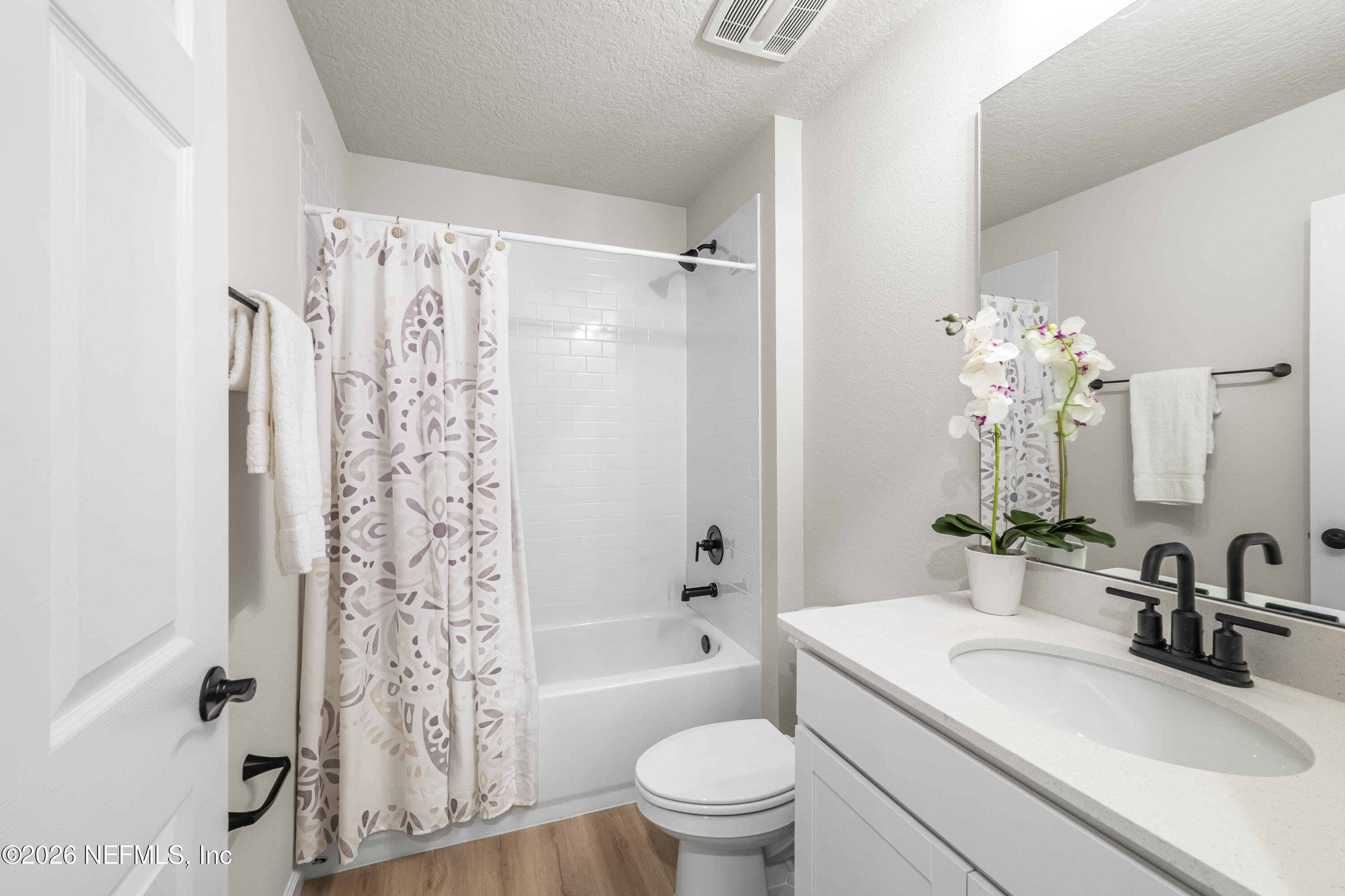 4355 Longmire Road Middleburg, FL 32068 - Photo 17 of 19 a bathroom with a sink toilet tub and shower