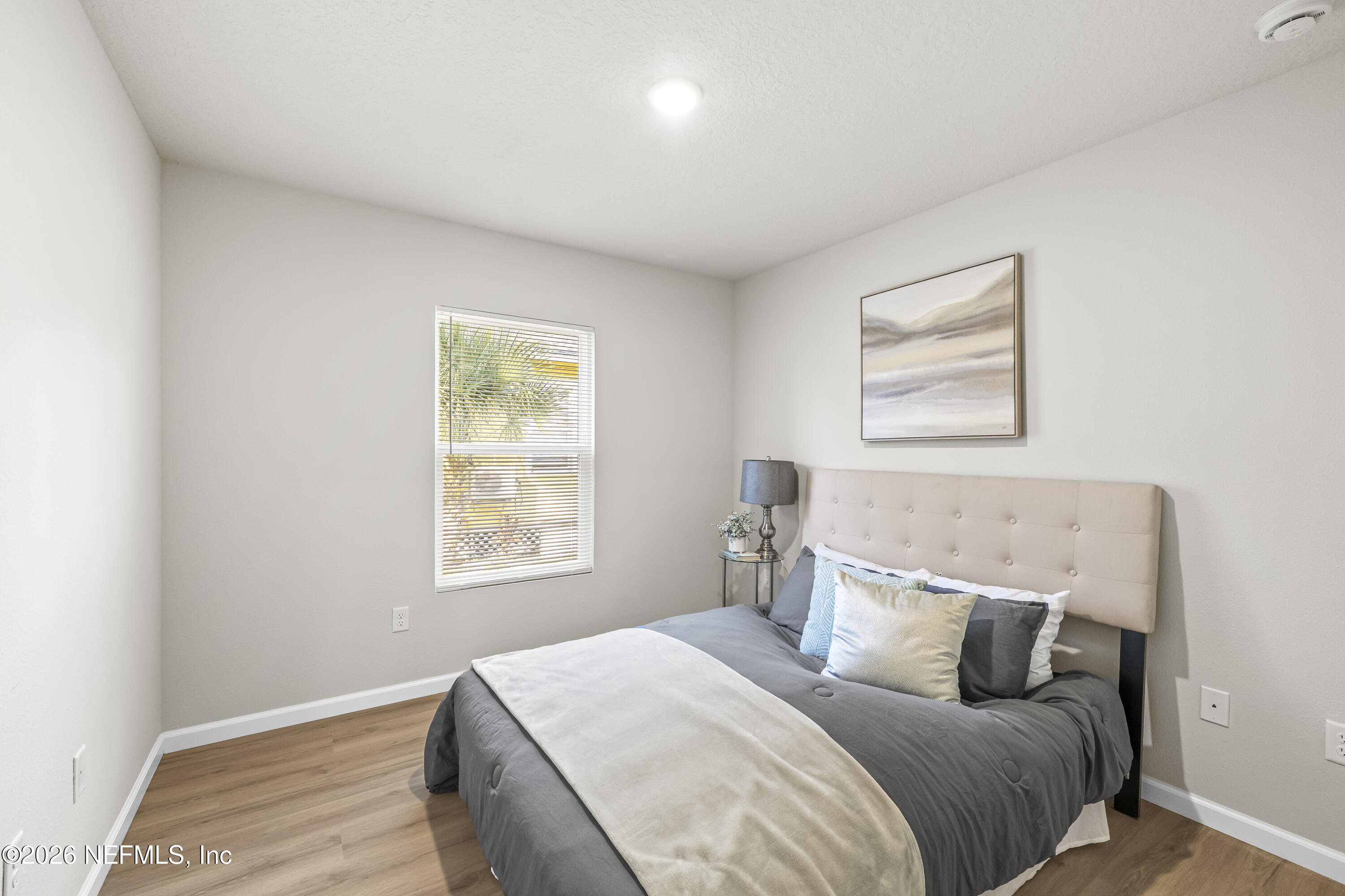 4355 Longmire Road Middleburg, FL 32068 - Photo 18 of 19 a bedroom with a bed and a window