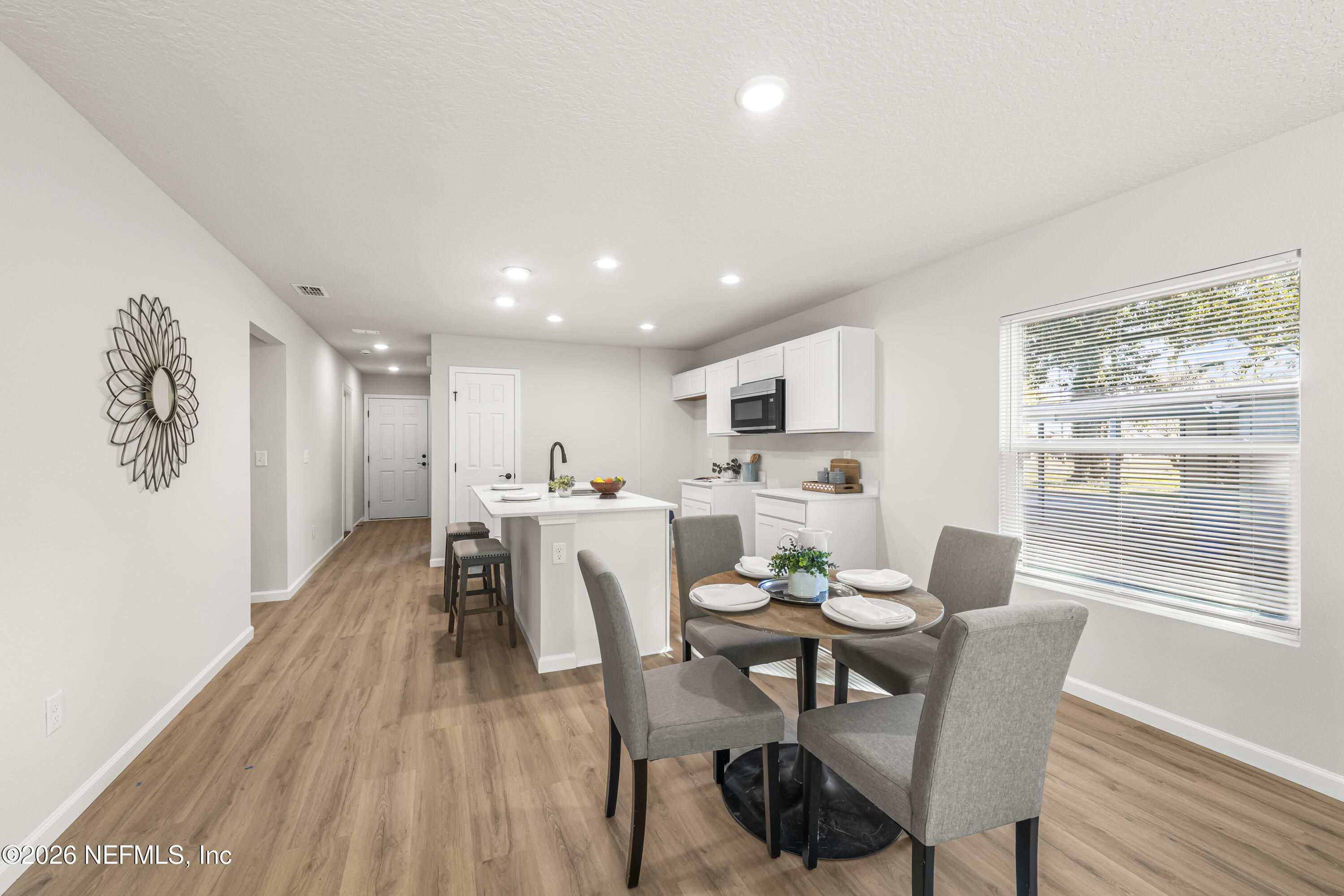 4355 Longmire Road Middleburg, FL 32068 - Photo 5 of 19 a dining room with furniture and wooden floor