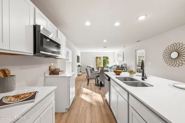 a kitchen with lots of counter top space and stainless steel appliances
