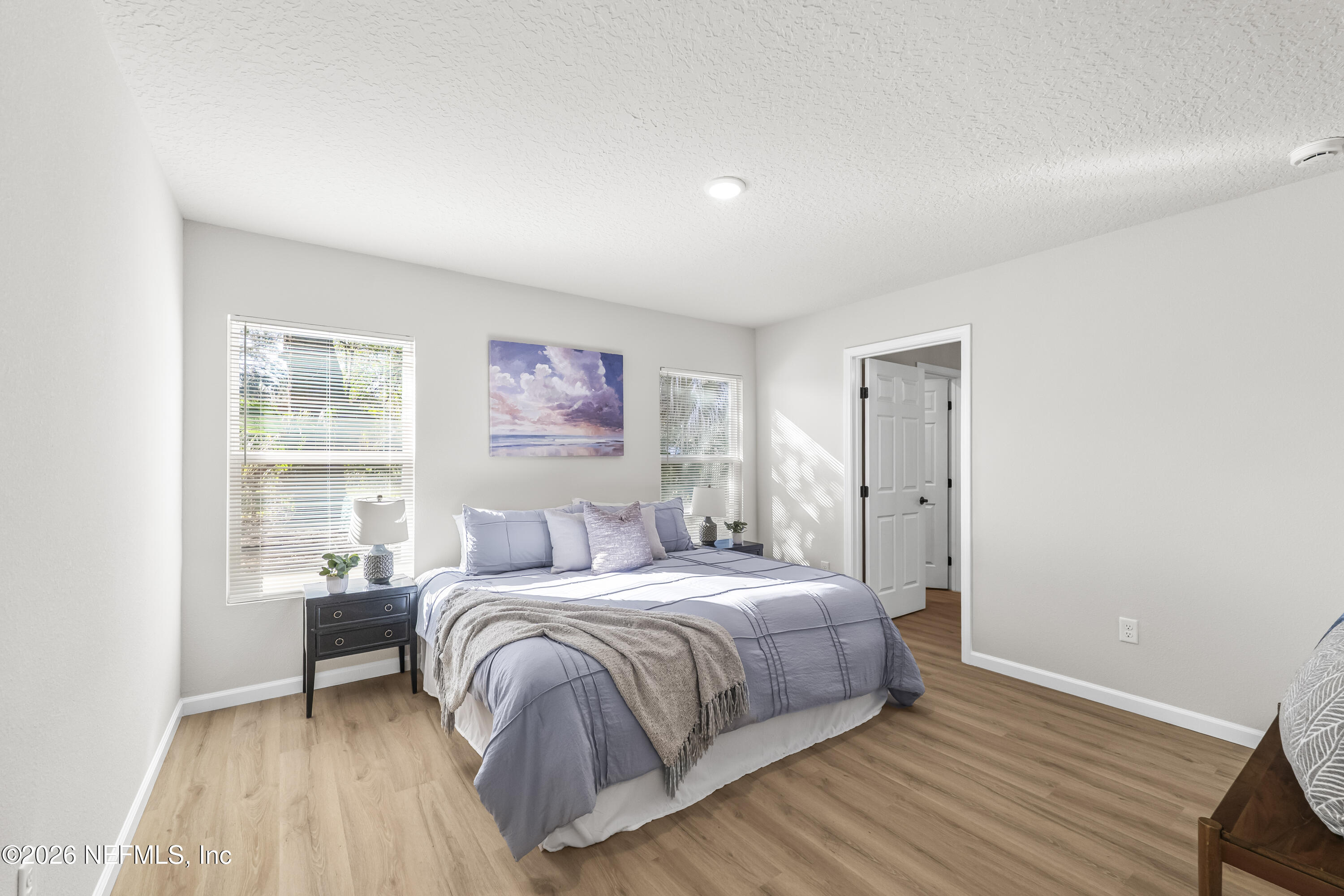 4355 Longmire Road Middleburg, FL 32068 - Photo 9 of 19 a bedroom with a bed and a window