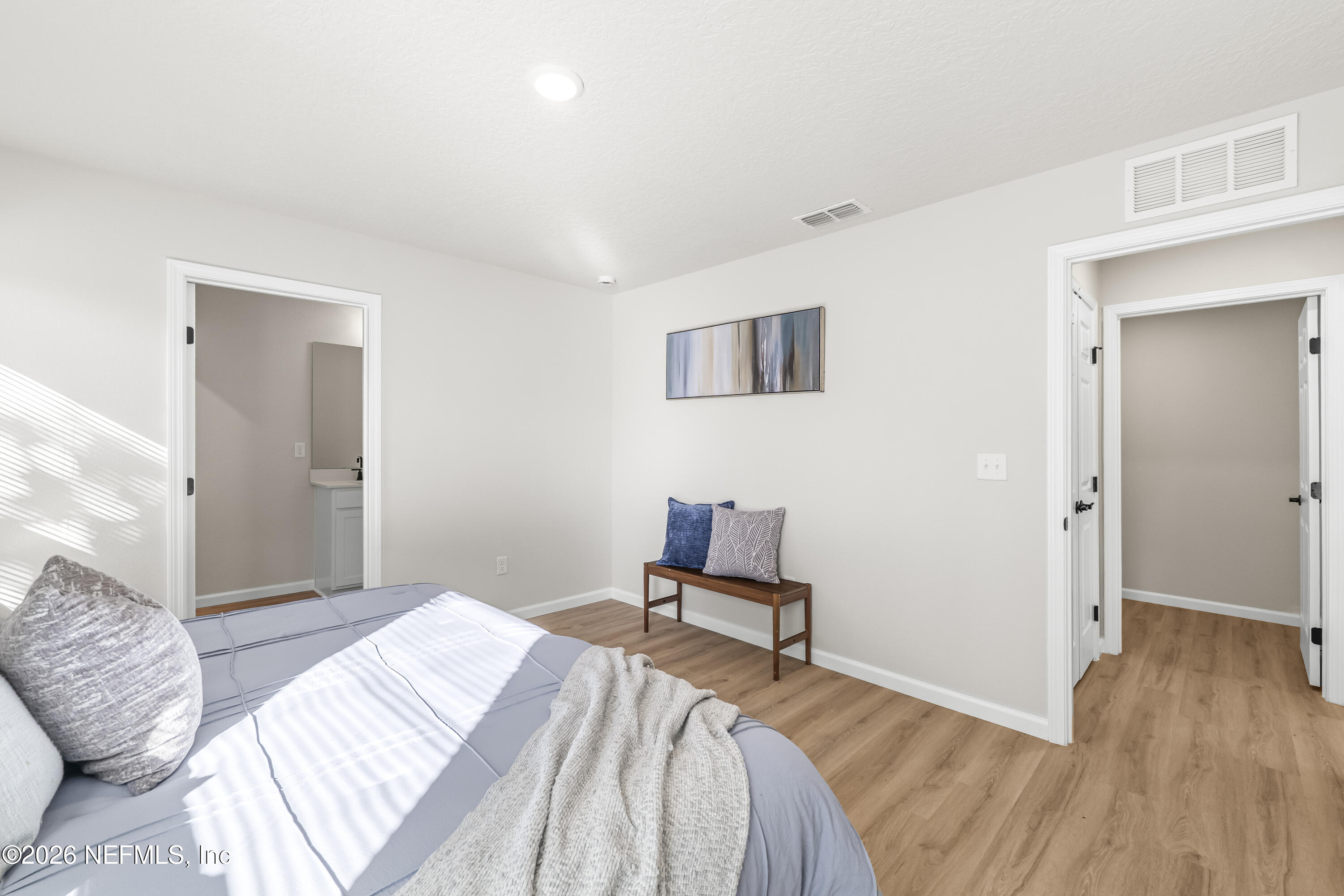 4355 Longmire Road Middleburg, FL 32068 - Photo 10 of 19 a bedroom with a bed and a table