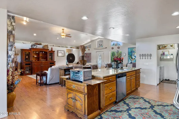 a dining room with furniture window and wooden floor