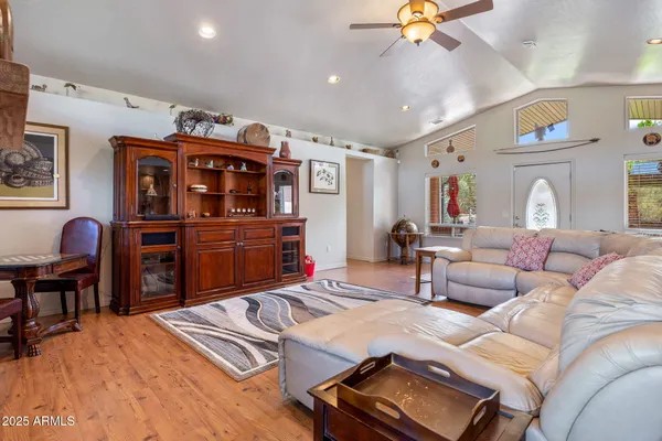 a view of a dining room with furniture kitchen and chandelier