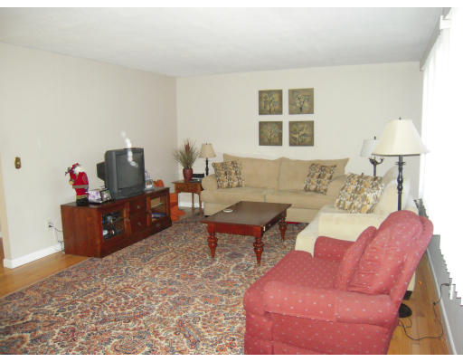 53 Stagecoach Road Amherst, MA 01002 - Photo 5 of 18 a living room with furniture a window and a table