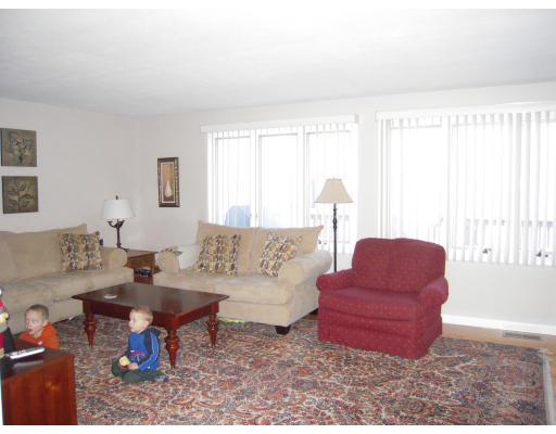 53 Stagecoach Road Amherst, MA 01002 - Photo 6 of 18 a living room with furniture and a large window