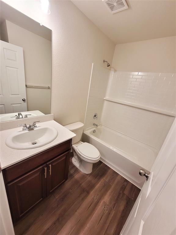 16029 Pemberly Lane Haslet, TX 76052 - Photo 13 of 19 a bathroom with a sink a toilet a mirror and shower