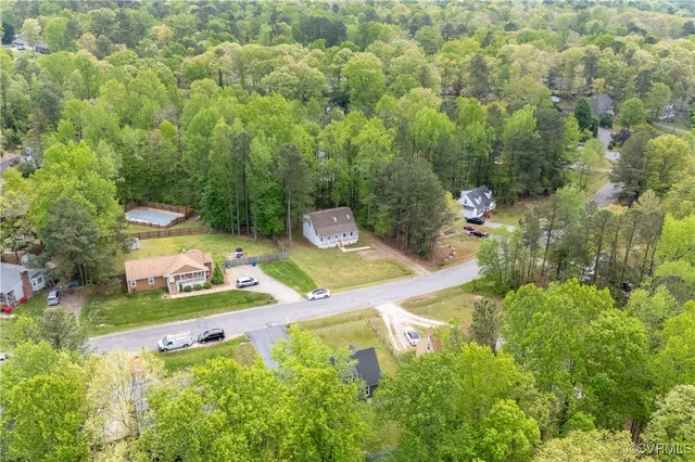 a view of a table and chairs in the garden