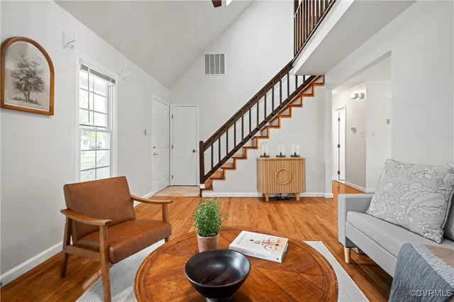 a living room with furniture and a chair