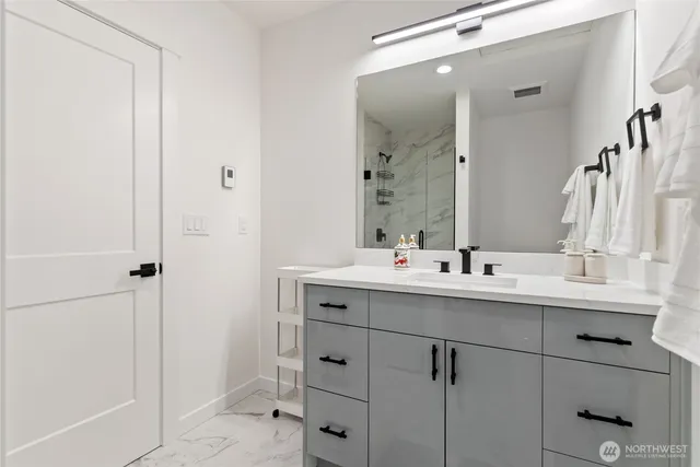 a bathroom with a shower and toilet