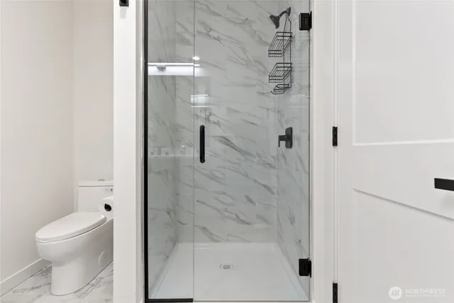 a bathroom with a sink toilet and mirror