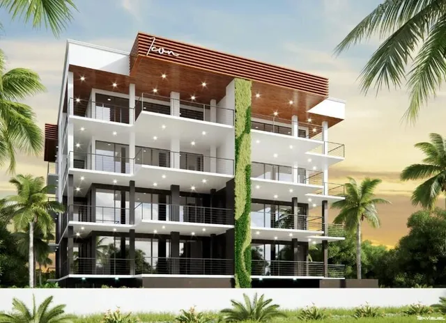 a front view of a building with a garden