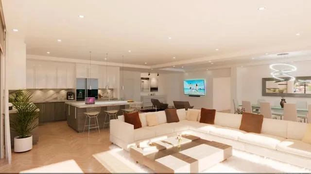 a living room with furniture a rug and white walls